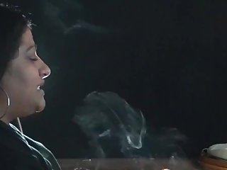 Indian lady smokes. Great talk exhales.