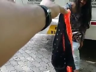 Indian girl removes dress on road